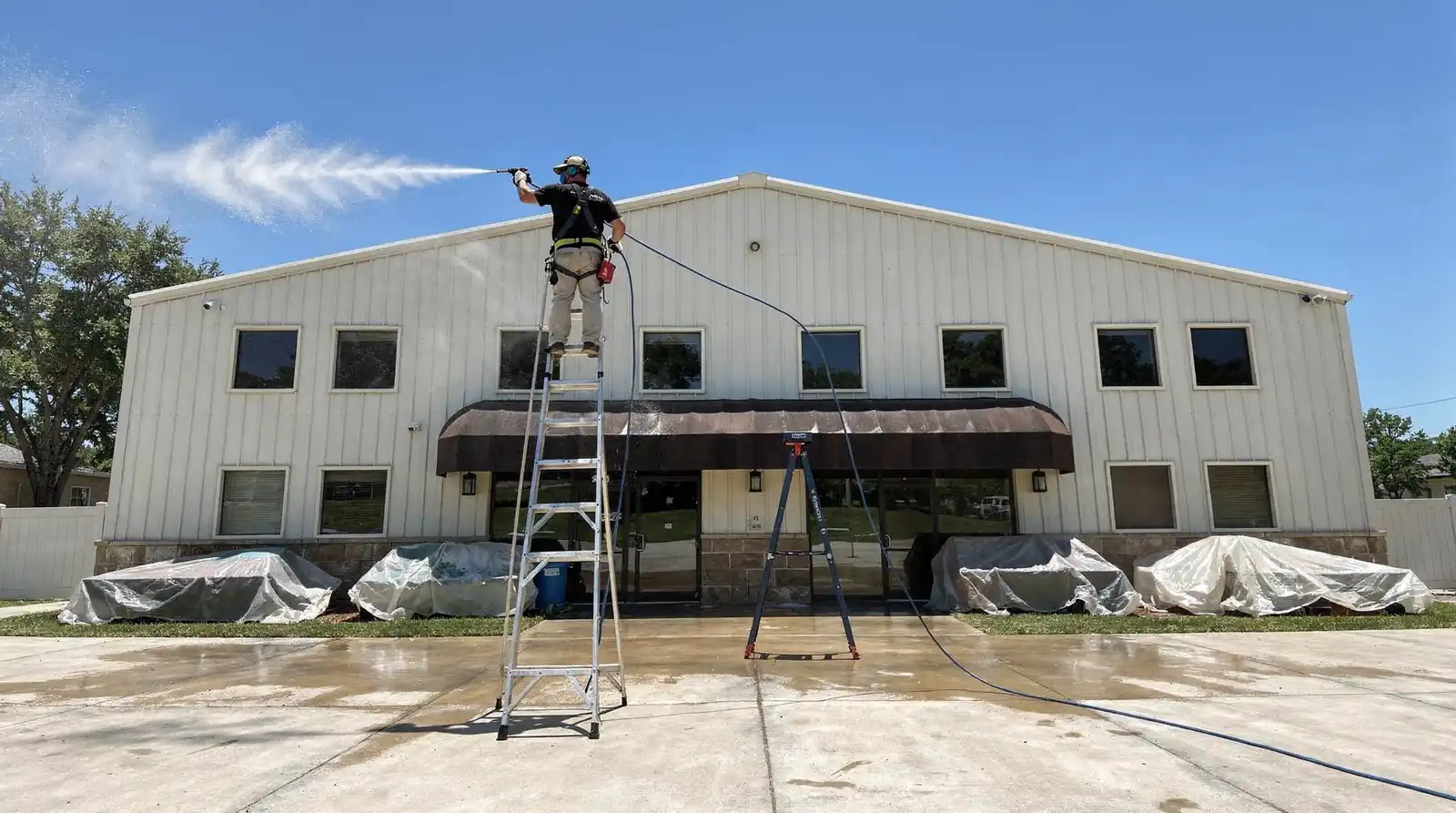 A complete package covers four surface categories: roofing, siding, decking, and concrete. Residential power washing